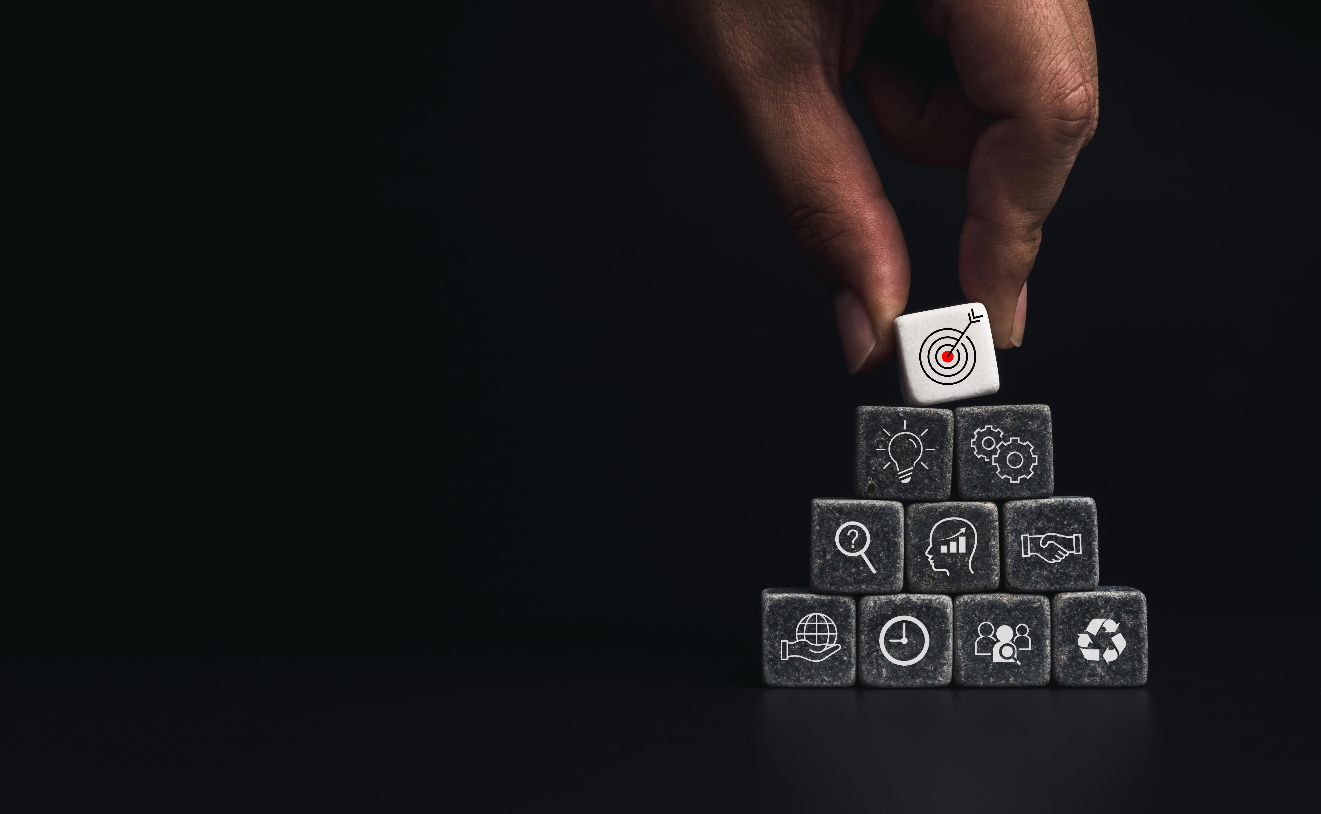 Business Strategy With Growth Success Process Leadership Teamwork Concept Hand Putting Business Target Icon Dice Cube Blocks Stack Pyramid Shape Dark Background With Copy Space